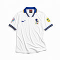 Fronte maglia away Italia 1996 con stemma FIGC e colletto azzurro/oro.
