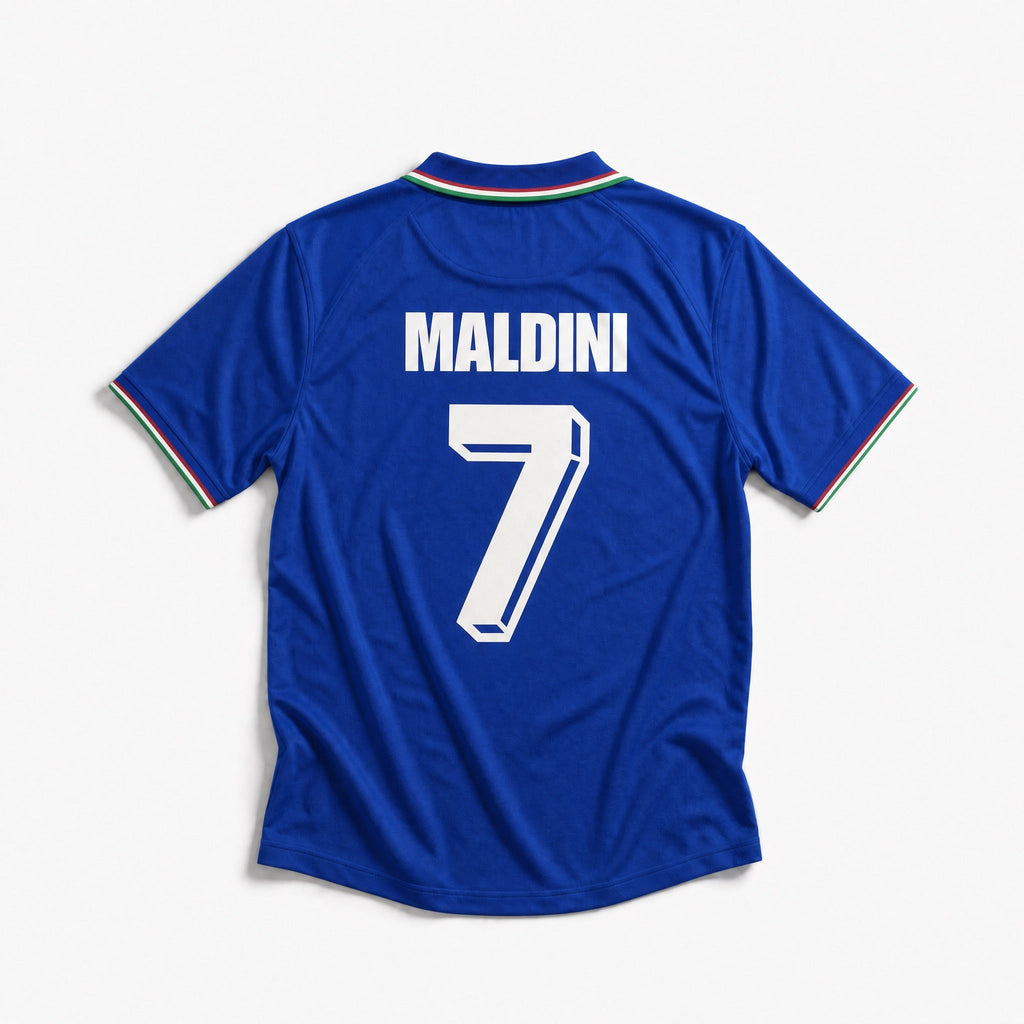 Fronte maglia home Italia 1990 con colletto a polo tricolore e stemma FIGC.